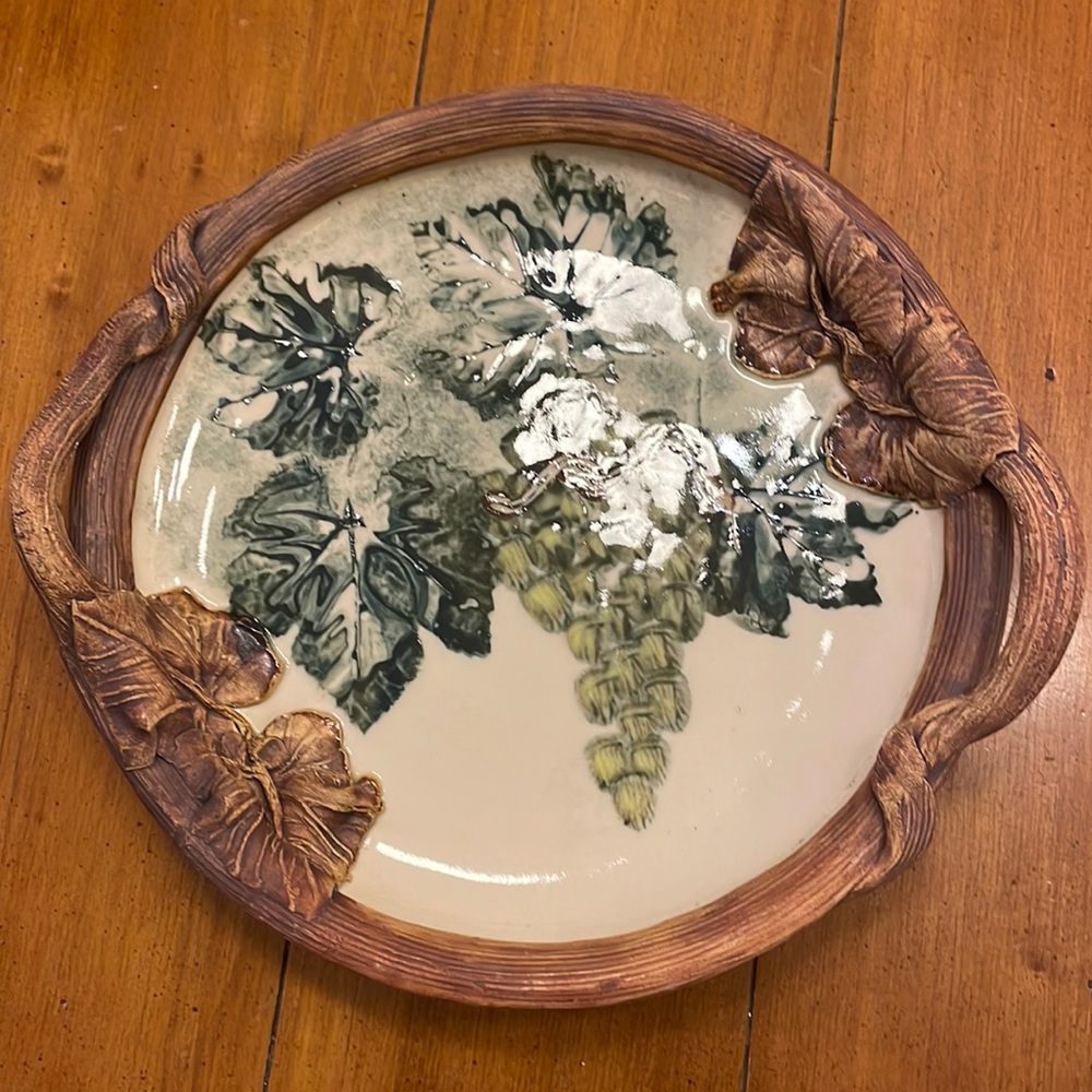 Signed round Terra Firma hand painted terra cotta serving/decorative piece.